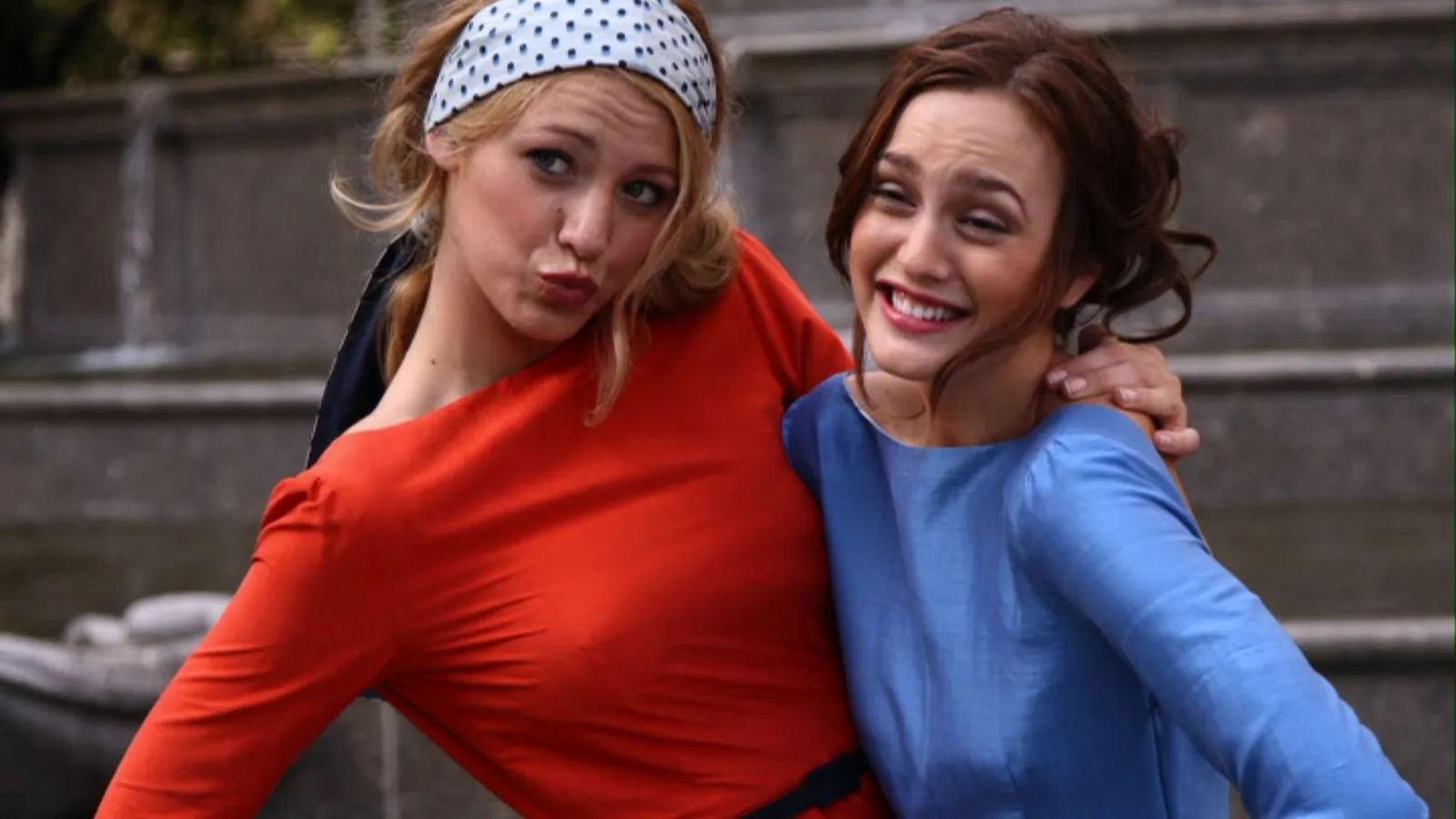 Serena and Blair smiling together during their Gossip Girl photoshoot at Pulitzer Fountain
