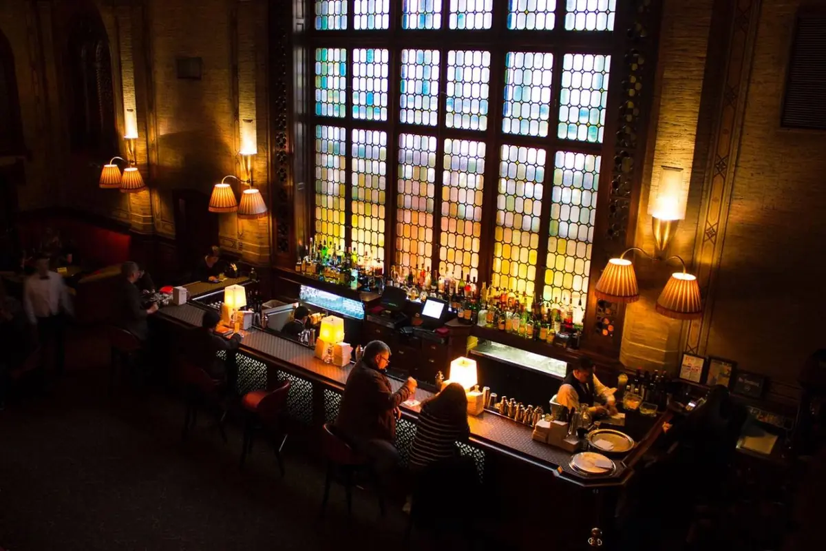 The Campbell cocktail bar with atmospheric lighting and stained glass