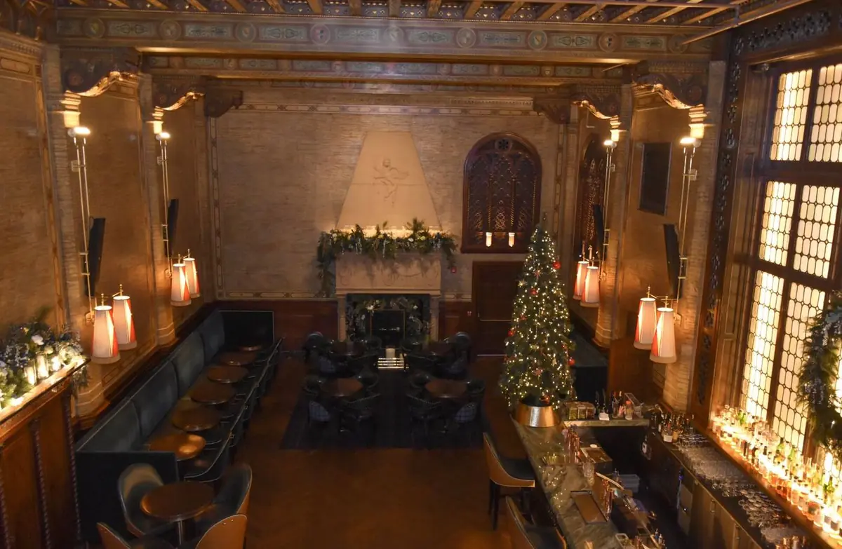 The Campbell decorated for Christmas with fireplace and holiday tree