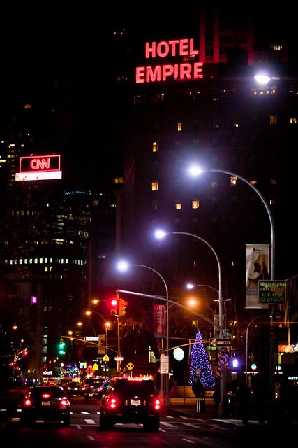 The Empire Hotel neon sign illuminated at night - iconic Gossip Girl NYC nighttime view