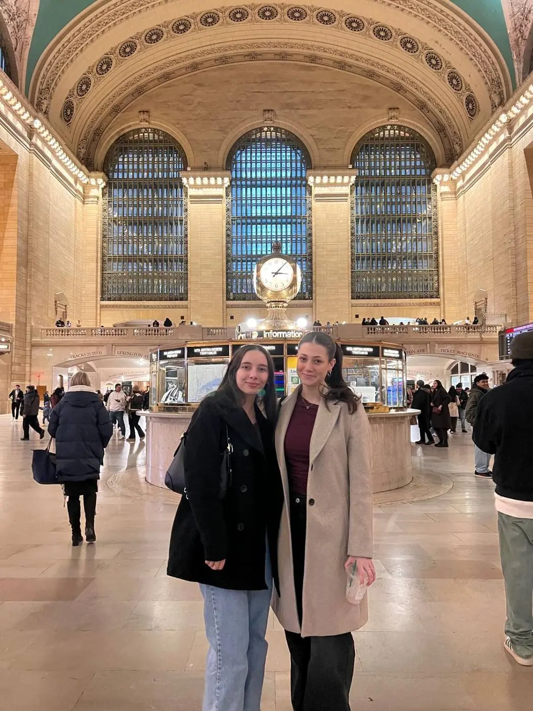 Tour guests posing at Grand Central Terminal information booth clock - Gossip Girl pedicab tour NYC