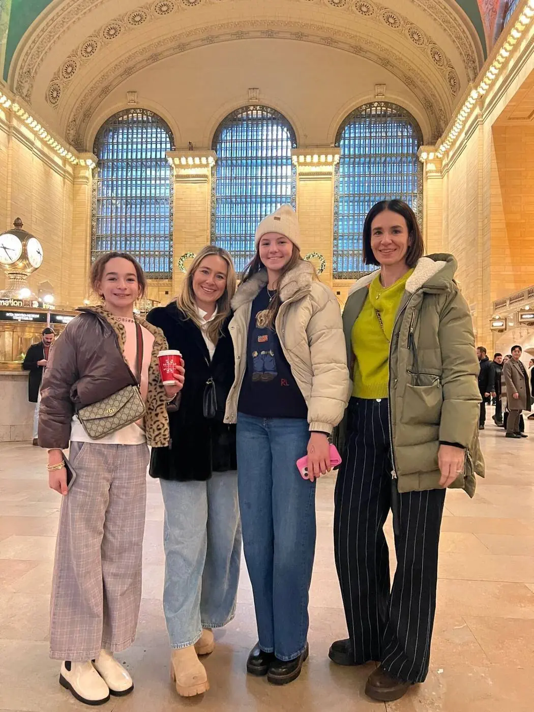 Family group photo inside Grand Central Terminal main concourse - Gossip Girl NYC tour experience