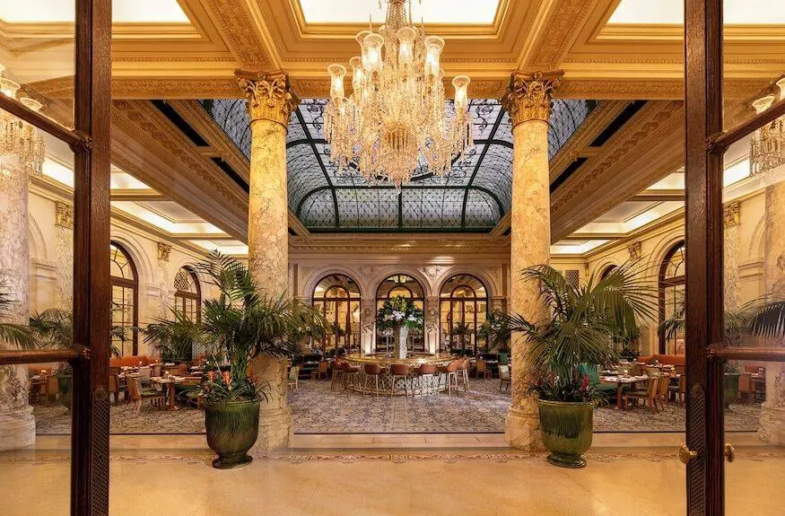 The Plaza Hotel Palm Court restaurant with crystal chandelier - Gossip Girl elite dining scene location Manhattan