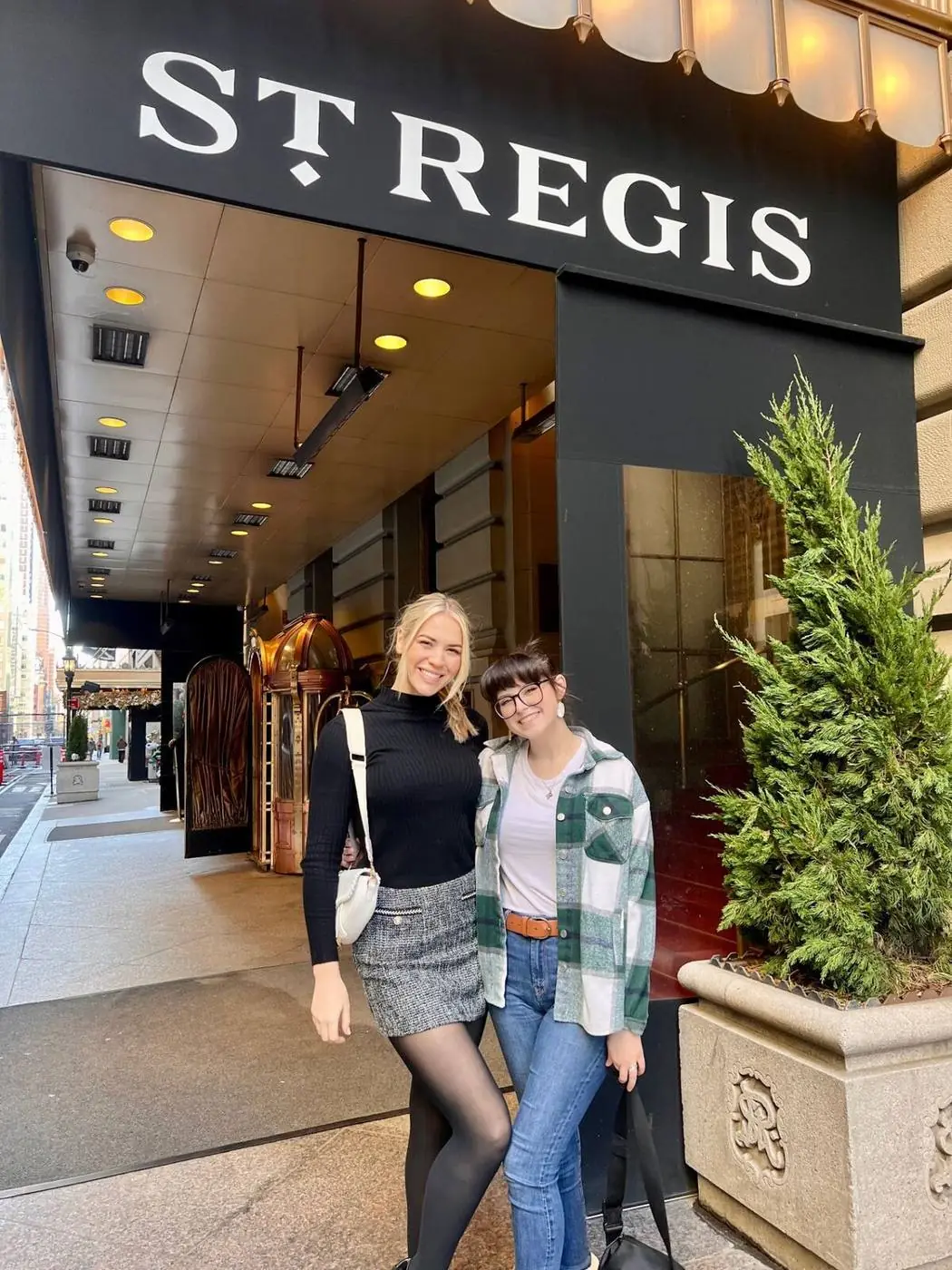 Gossip Girl tour guests posing at The St. Regis New York entrance